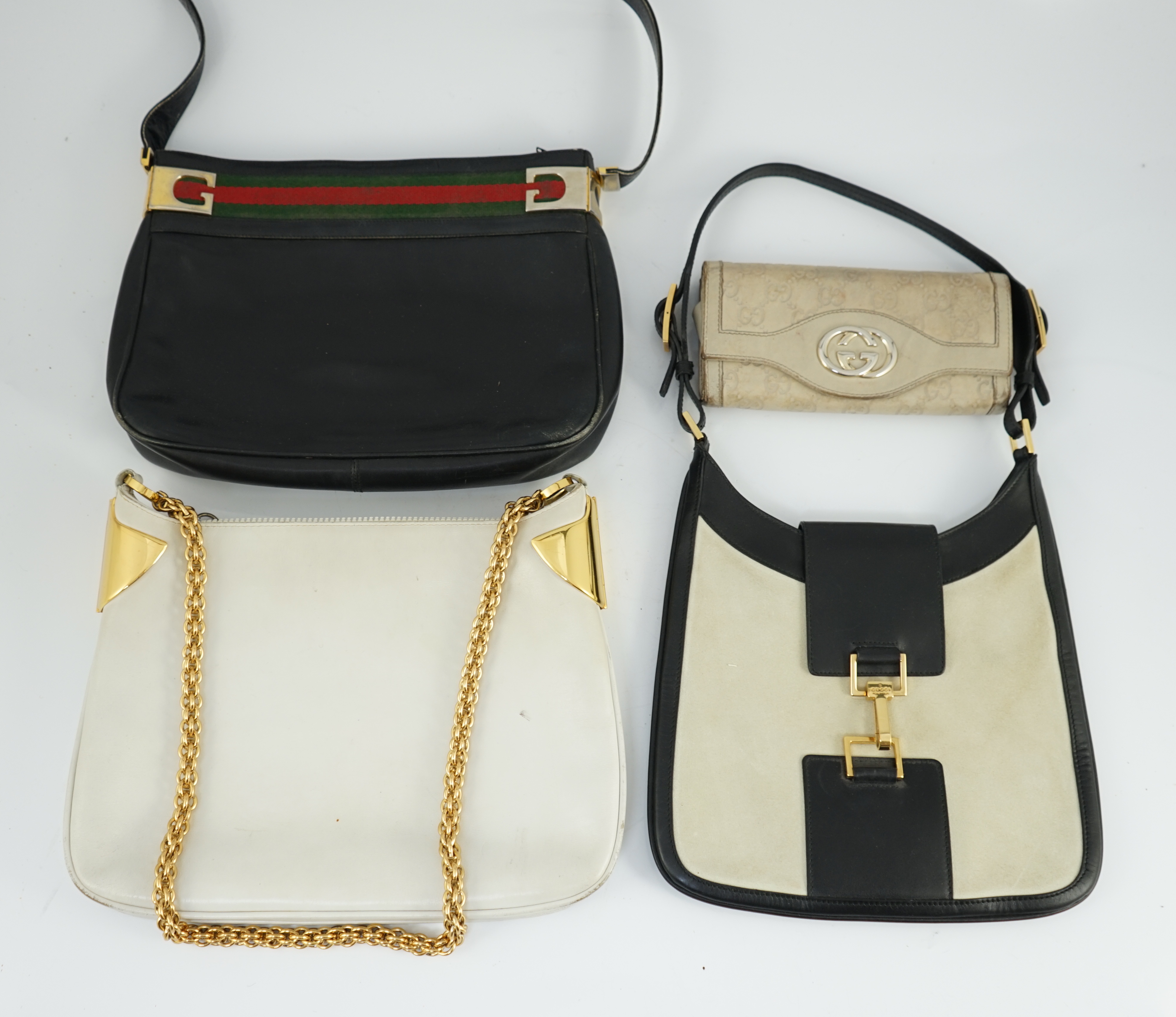 Three vintage Gucci hand bags and clutch wallet
